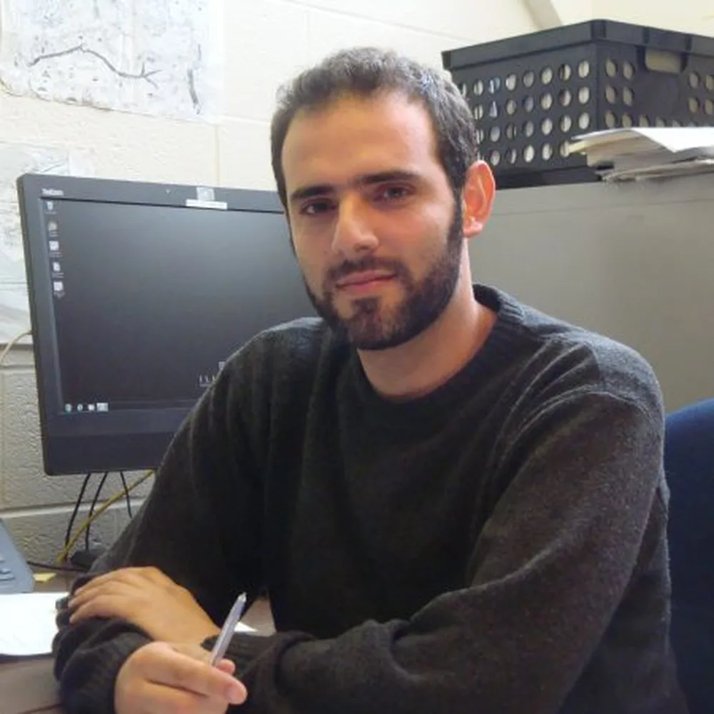 a head shot of Professor Mauro